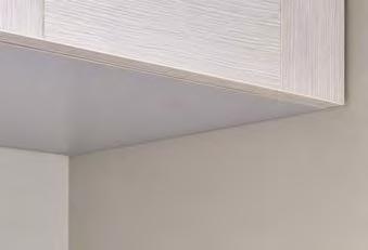Two simple brackets make range hood installation easy for one person.