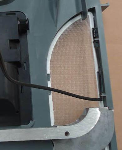 Remove the liner from the foam tape and position on the base so screw hole and air openings are aligned. Place flange of duct on right hand side when facing front. See FIG. 7. FIG. 7 Front FIG.