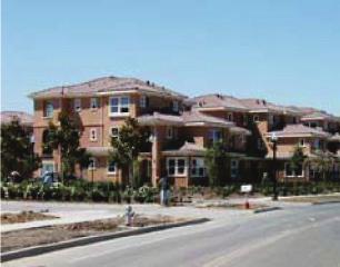 Photo IV-2: This multi-family project is located across the street from singlefamily homes.