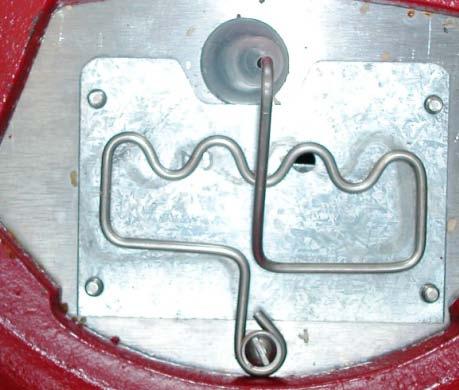 Step 3: Slide the stainless steel agitator wire (black arrow) to the side.