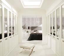With its mirrored doors, plain crisp white finish and traditional iron handle, this dressing room