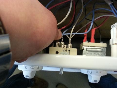 Remove the screws that fix the energy metering device.