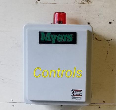 The Control Panel Box The control panel box to your grinder pump is located on the side of your home that measures approximately 12" and has a red alarm light on top.
