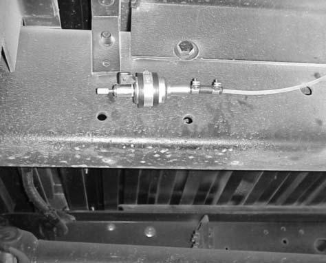 To minimize cuttings dropping into the tank, coat drill bit with a small amount of grease. 3.
