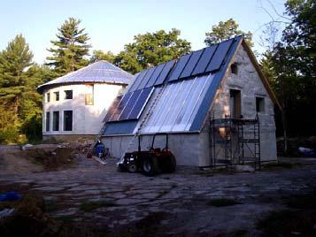 The more common situation, however, is one with solar panels on top and water tank below.