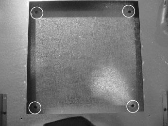 Locate heat shield cover plate removed in the fi rst step.