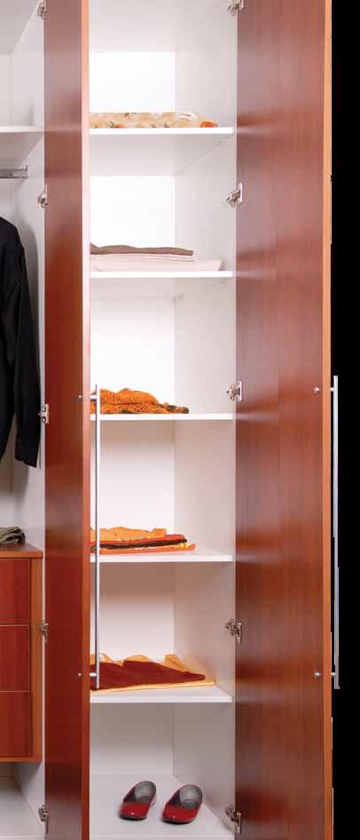 The warm cherrywood tones of this closet are contrasted with the bright white lacquered glass.