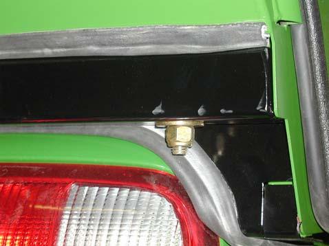Figure 4 8) Lower the cab over the tractor until the front and rear isolator bushings are resting on the