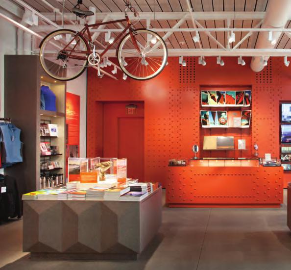 At the back of the store, a laminate feature wall in the signature International Orange is studded with rivets like those found on the bridge.