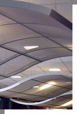 This can be achieved in many ways by simply utilizing another layer of a drop ceiling system that screens the
