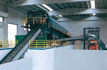 Ecomaster. A conveyor belt lifts the shredded material up to the inlet chute of a rotary screen.