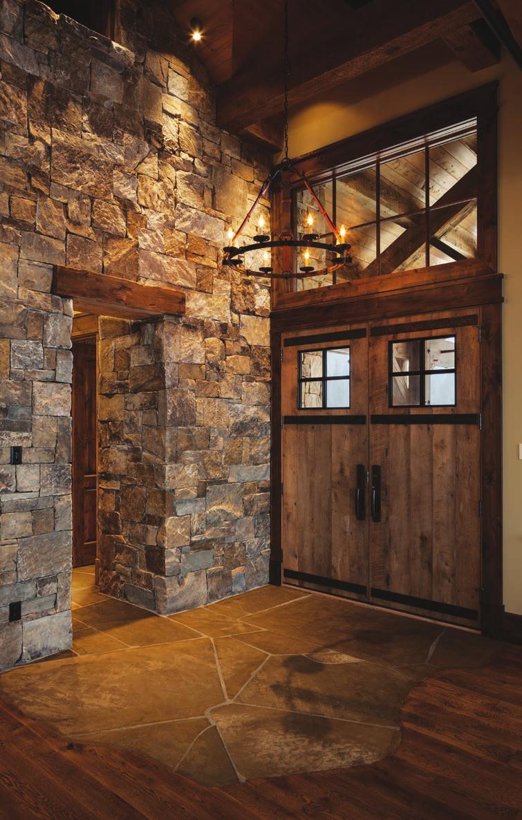 Hammered steel straps cover the doors over circlesawn reclaimed oak planks for a look that will stand the test of time.