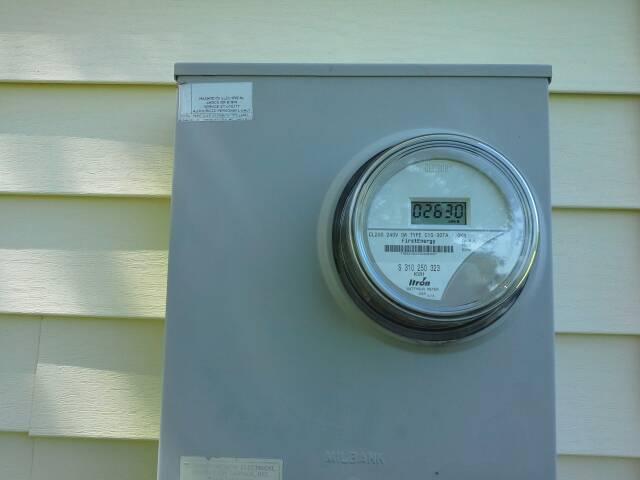 Electric meter on south side of house. Missing bulb on west side motion light.