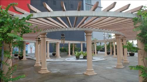 Figure 2: Pergola with wind chimes, embossed woodcarvings and scented Rangoon creepers.