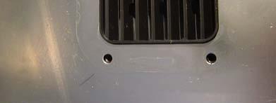 With the control panel removed, remove the two screws shown in FIG 21 Now close the door
