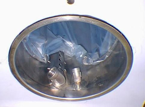 Make sure bag is under the vapor manifold, and waste intake valve making sure they are not blocked or covered. Vapour manifold 7. Pour solvent waste into receptacle bag. Maximum level is 3.