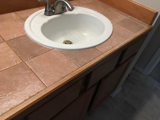 Counters Tile counter tops are in good condition overall.