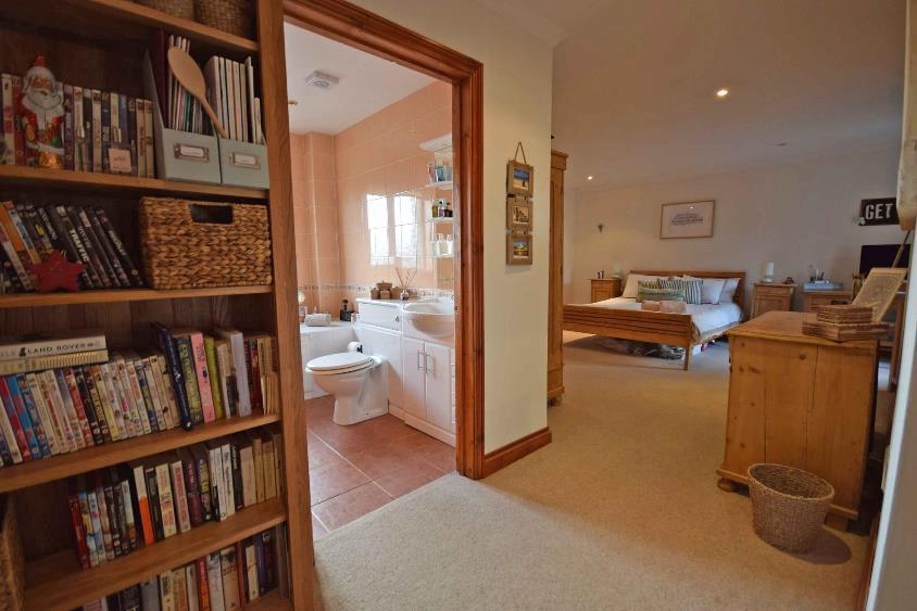 5 From the other end of the sitting/dining room a glazed panelled door opens on to a wide inner hallway which has a coved ceiling with inset downlighters, wall mounted thermostatic control for the