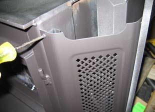 7) Remove the two screws which were concealed by the ashlip and two screws near the top from the left and right panels.