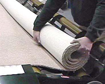 ROLLING UP THE CARPET STRAIGHT As long as your floor and machine are level and the main roll on the Left Hand Side Cradle is rolled up relatively straight, then the carpet will roll-up fairly