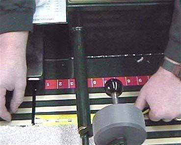 Using a tape, measure the section of material between the back edge of the carpet and the Cutting Track, and add it to the amount that is already recorded on the Counter's Screen.