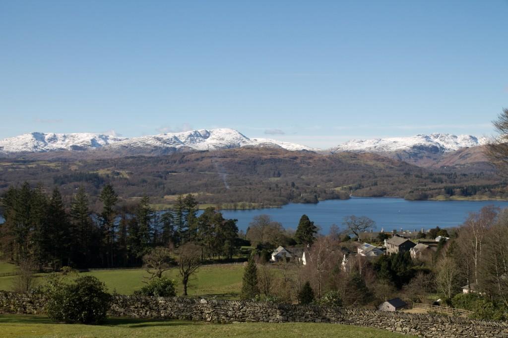 View to Lake and Mountains The Lodge Entrance Hall with built in cupboard, slate floor and patio doors leading out to paved patio area and gardens, with panoramic views to Lake Windermere and the