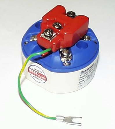 It mounts right on the top of the STT250 or STT150 terminal block, providing easy field wiring and also protection for the integral meter if used.