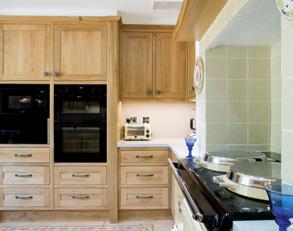 The use of timber to create useful and visually effective storage within this kitchen was paramount, with the resultant strong lines broken by glazed and recessed display cupboards as well as a