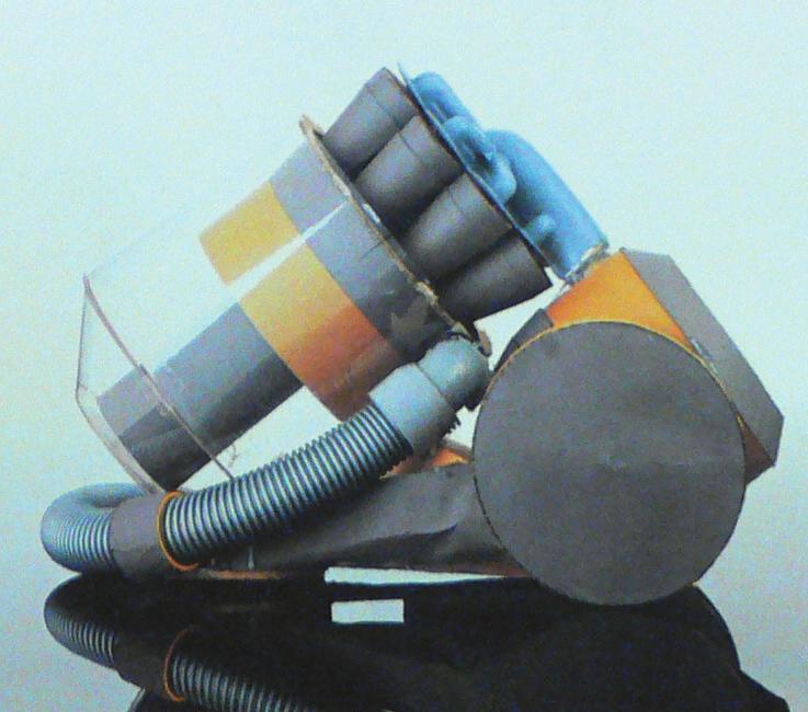1983 Dyson produces his ﬁrst prototype vacuum cleaner, a very post modern pink machine called the G-FORCE, which makes the front cover of Design MAGAZINE 1983.