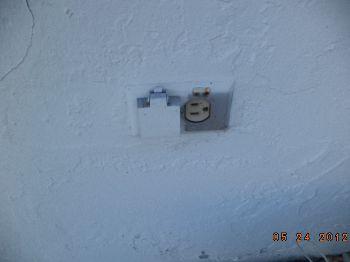 Replace the damaged waterproof cover on the left elevation outlet GFCI: Ground Fault Circuit interrupter. The existing outlets on the exterior of the house are not GFCI outlets.