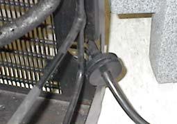 9. Remove the power cord from the refrigeration assembly. a. Slide the bushing sideways away from the refrigeration module until it is free (Figure 7). Avoid bending the refrigeration tubing. b. Pull the power cord through the module.