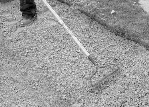 Pound temporary stakes to the correct grade at several locations (figure 2). Use a tamper or vibrating plate compactor to compact loose soil in the excavated area.