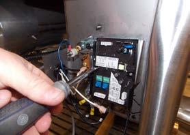 Install the new thermostat onto the mounting bracket using the 6-32 screws from the