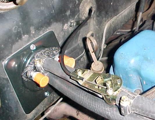 The cable attached to the defrost control lever should be routed and connected to the defrost duct assembly. NOTE: Insert cable wire into second hole from the end of the crank arm.