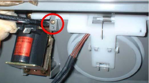 (-) screw driver into bottom left groove of Cover Dispenser