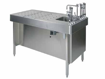 Integral downdraft ventilation assembly provides a passageway for fumes to be exhausted downward through the work surface A large single-compartment sink is provided on the end of the table, along
