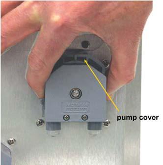 Using your thumb and forefinger gently pinch the sides of the pump cover. Slide the cover upwards to remove it. See Figure 9-7. FIGURE 9-7.