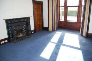 12 m x 5.82 m ( into the bay window) The carpeted lounge has two radiators and has a bay window to the front elevation.