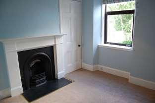 To either side of the fireplace are shelved alcoves with glass display doors. DINING ROOM Approx. 6.06 m x 4.