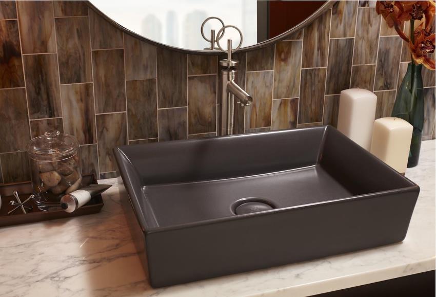 The DXV Pop Rectangle Vessel Sink is available in chenille gray, a neutral shade that is perfectly paired