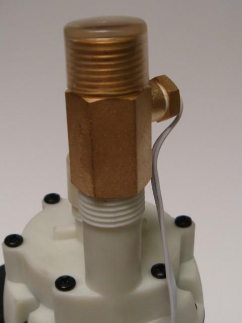 Insert the white washer into the brass fitting and thread it onto the tallest fitting (the outlet to the cold water line), then thread the sensor into the side of the brass fitting.