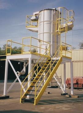 Designing dryers to fit into existing structures is a challenge that SDS engineers welcome. This spray dryer was designed for a ceramic powder.