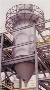 This spray dryer uses pressure nozzles although the slurry is very abrasive. The tight particle size distribution was required to improve quality and energy efficiency of a downstream process.