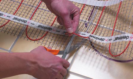 When the Devimat reaches the end of the run, simply cut the grey mesh (NOT THE RED CABLE) and