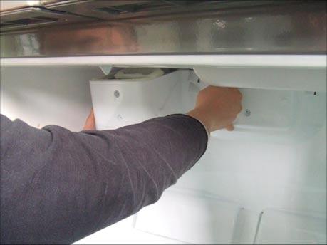 Unplug Refrigerator, or disconnect power at the circuit breaker. 2. If necessary, remove top shelf or shelves. 3. Using a flat instrument, gently pry the cover loose in the front as shown.