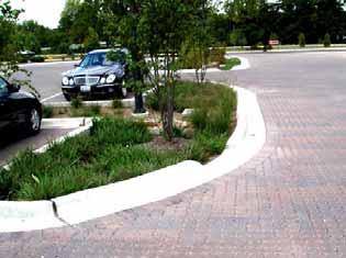 Guideline 34: Use sodded areas and shrub beds within parking areas to collect, store and filter stormwater in order to improve groundwater recharge (Figure 25).