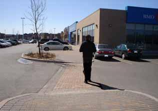 Provide additional width where doors swing out and car bumpers can potentially interfere with the walkway. Make all other on-site pedestrian walkways at least 1.5 metres wide (Figure 11).