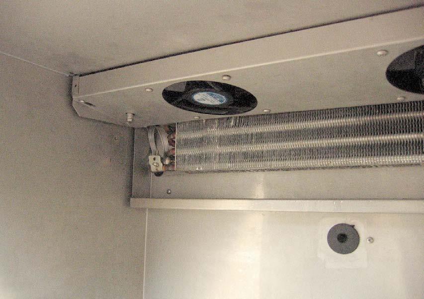 You should be able to see two fans, the evaporator coil, TXV bulb and