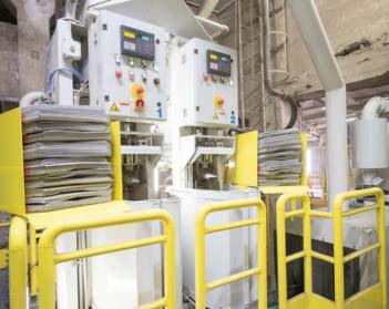 The components for placing, filling and closing the bag, the control, the control terminal and the discharging belt conveyor can be optionally enclosed in a dust-proof structure which reduces the