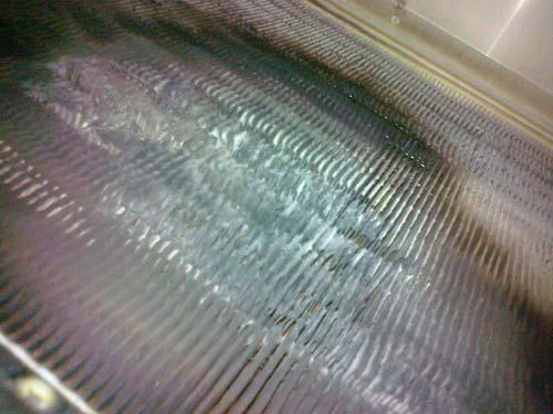 Labconco Corporation image of a biosafety cabinet HEPA filter damaged from use of an open flame inside the cabinet. Presents a potential fire or explosion within the cabinet.